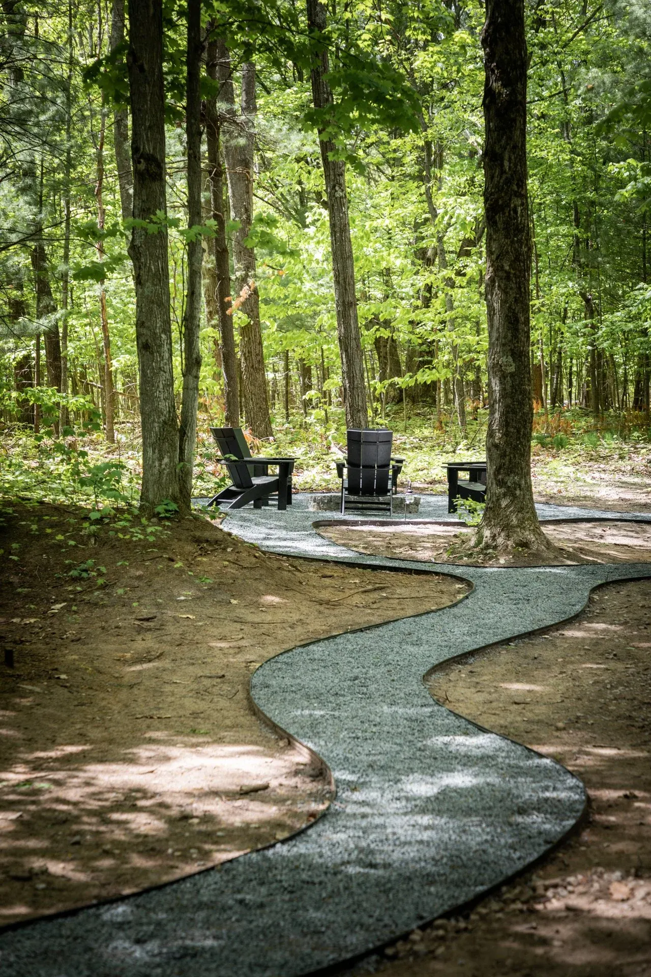 Cozy outdoor firepit area surrounded by woods at Roost A-Frame