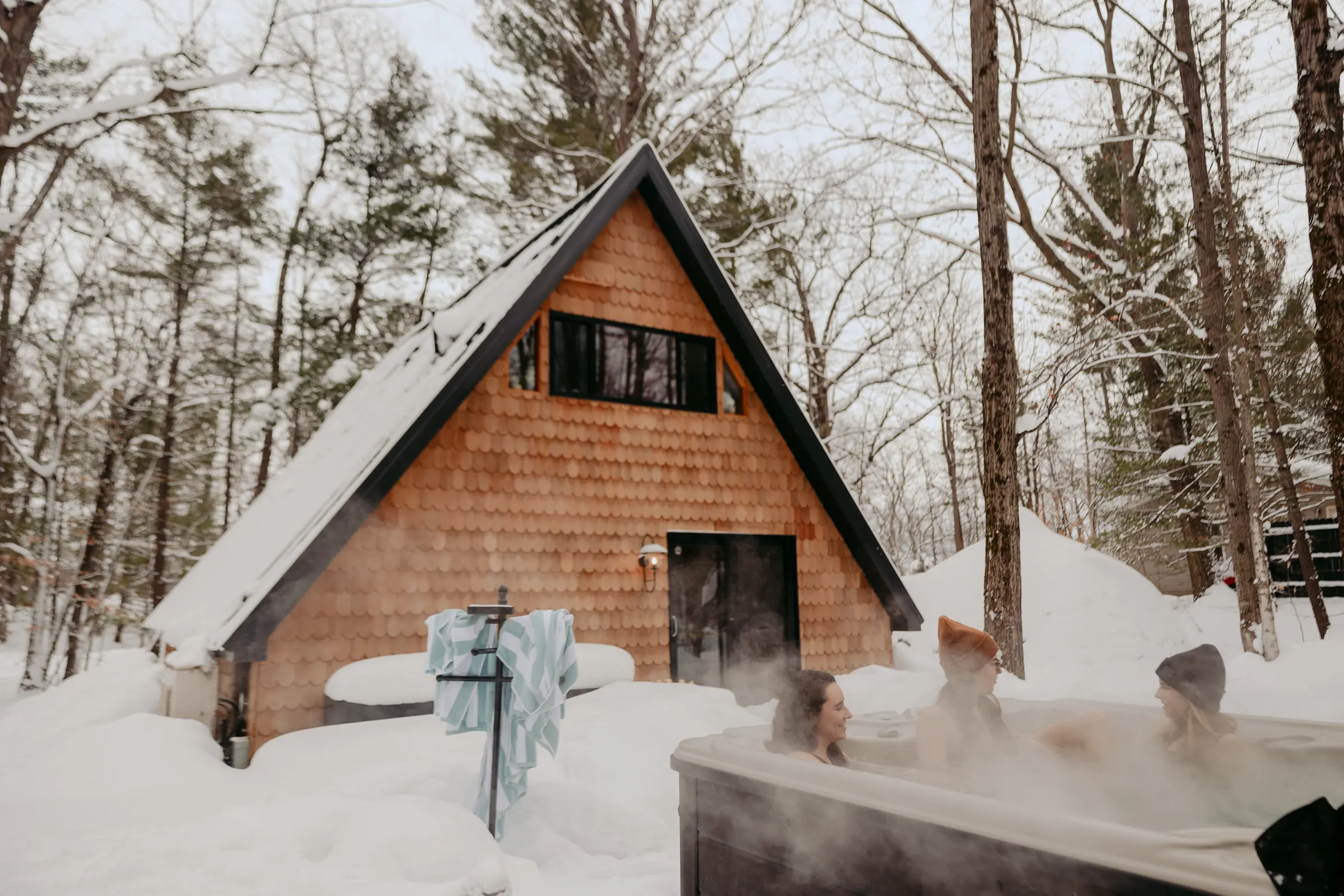 Private, relaxing hot tub on the back deck at Roost A-Frame in Lake Ann, Michigan