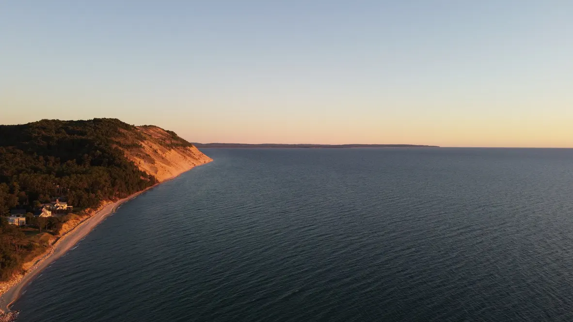 Aerial view of Empire Bluff and the Sleeping Bear Dunes shoreline rising above Lake Michigan