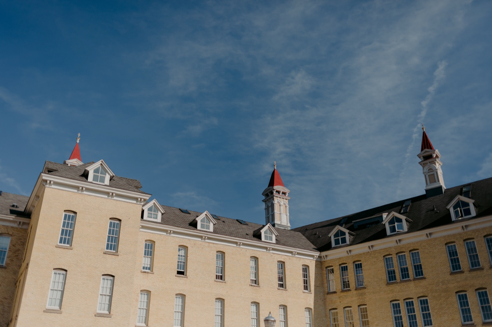 Historic brick buildings with red-topped cupolas at the Village at Grand Traverse Commons in Traverse City